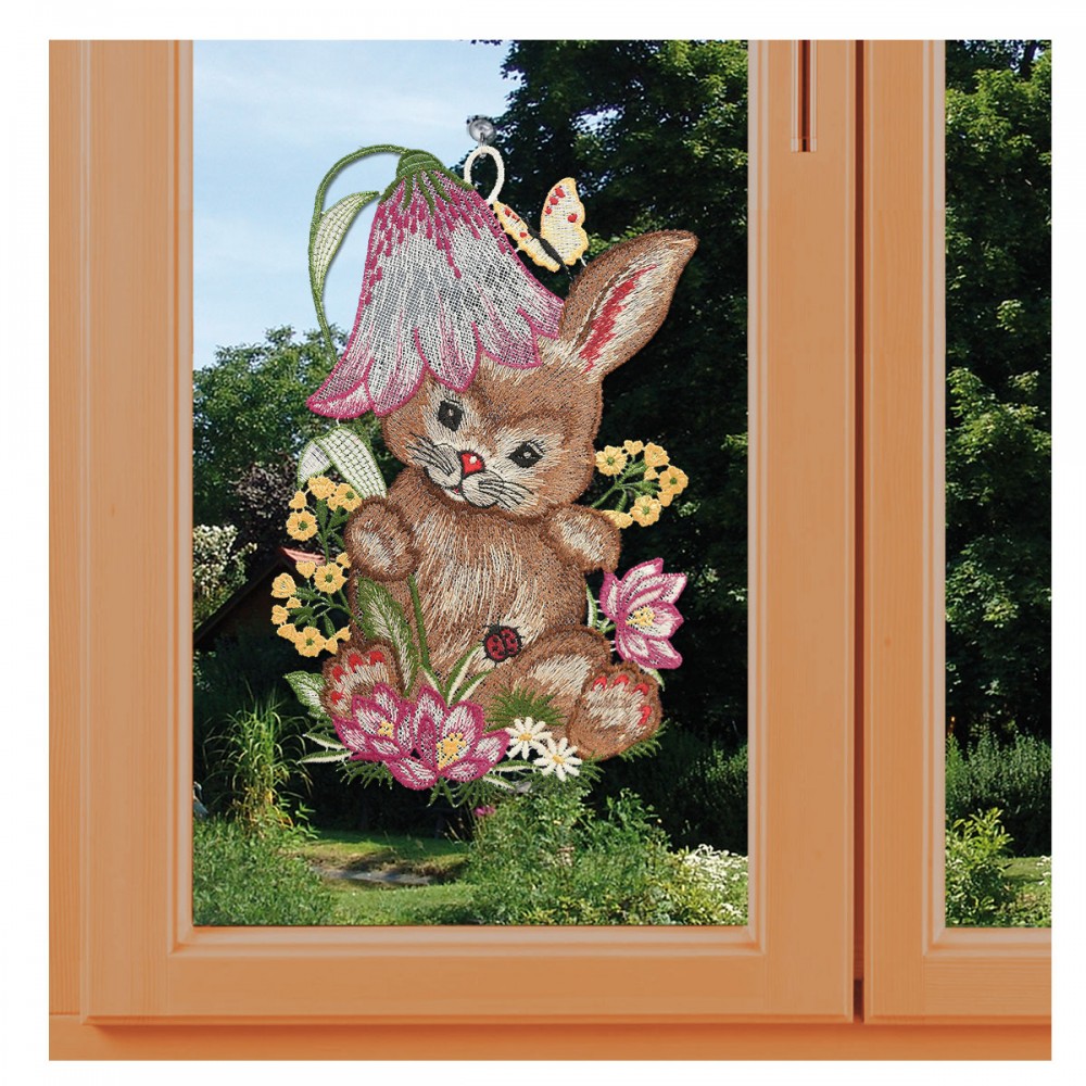 Fensterbild Osterhase mit Glockenblume an einem Fenster