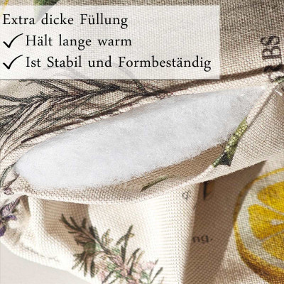 Eine Nahaufnahme eines Stoffbeutels mit Blumen- und Zitronenmustern. Der Beutel ist teilweise geöffnet und zeigt eine dicke Füllung. Texteinblendungen in deutscher Sprache heben die Merkmale hervor: „Extra dicke Füllung“, „Hält lange warm“ und „Ist stabil und formbeständig“.